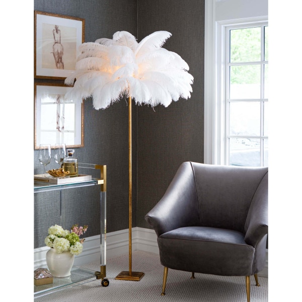 Living room corner with a gray chair and feather floor lamp